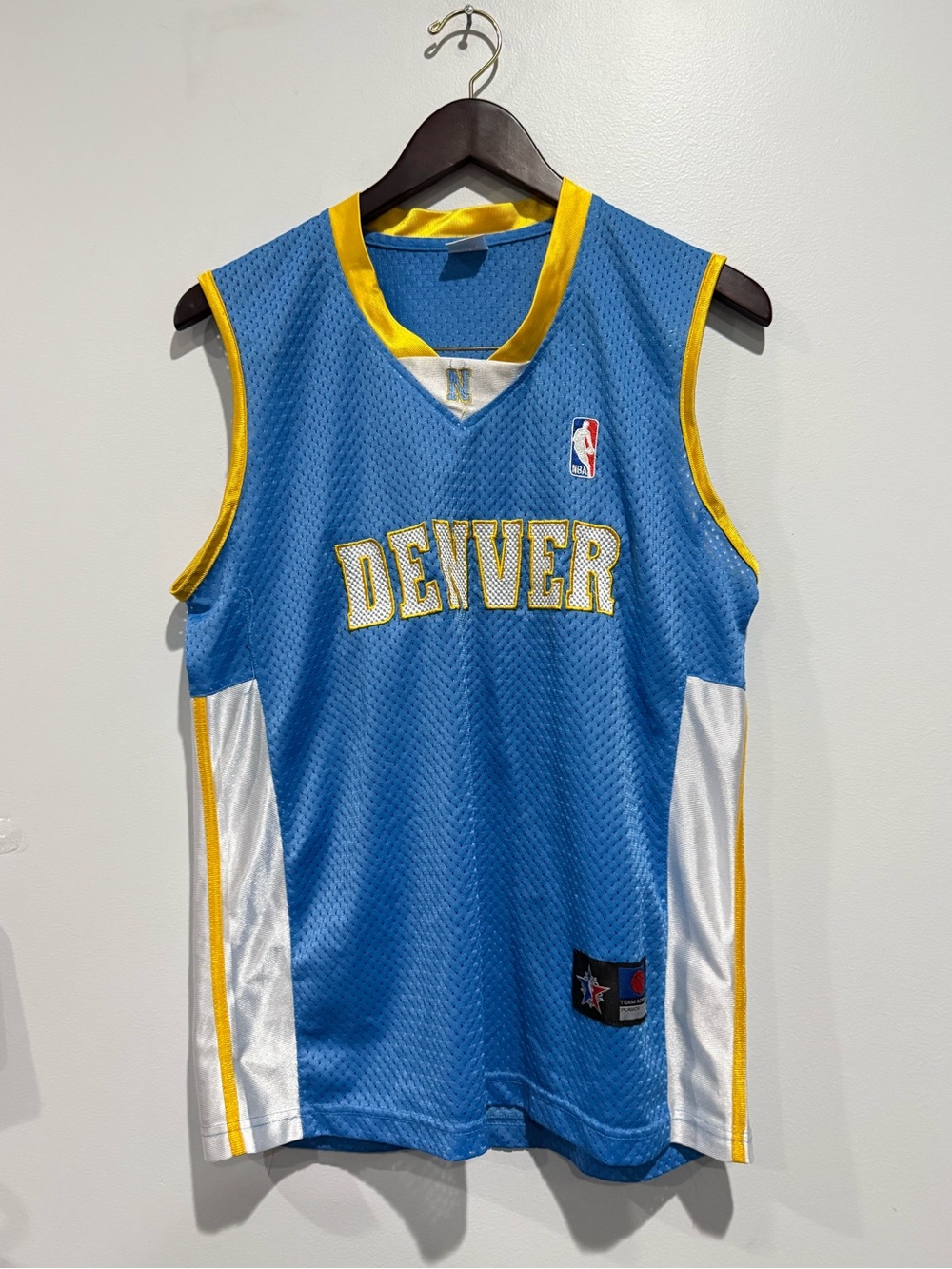 Vintage NBA Blue and Yellow Team Jersey Collar Detail